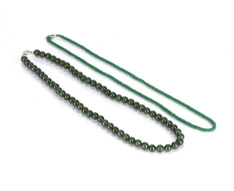 Two jade necklacesChineseof dark spinach colour approx 0.5cm across (bead size), the other of lighter colour, (both untested 