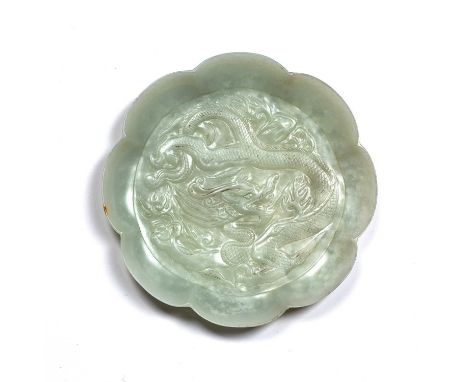 Jade flower shaped shallow dishChinese, Tang period or laterthe pale green and white speckled dish with carved encircling dra