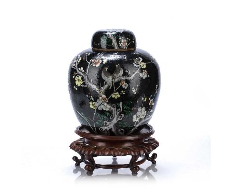 Famille noire ginger jar and coverChinese, 19th Centurypainted with birds and blossom, and with an associated hardwood stand,