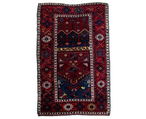 Red and blue ground prayer rugTurkishwith foliate and flowerhead designs, 212cm x 139cmSome light wear commensurate with the 