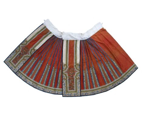 Orange ground silk skirt Chinese, 19th Centuryfinely decorated with panels of flowers and archaic symbols, the front panel de