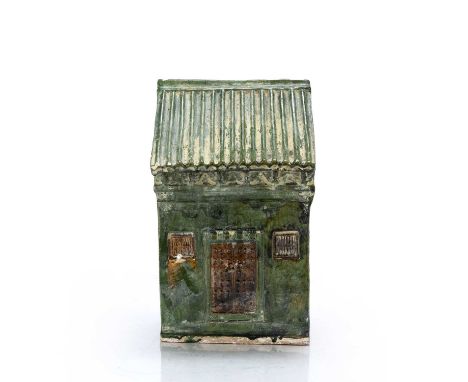 Glazed funerary model of a houseChinese, Han Dynastythe front decorated with a door to the centre surrounded by two windows o