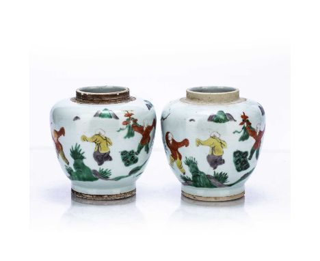 Pair of Wucai vasesChinese, 17th Centurydecorated to the body with boys dancing with kites, set against mountainous landscape