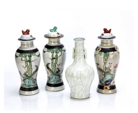 Garniture of three crackleware vases and coversChinese, 19th Centurypainted in enamels with phoenix and peonies and a crackle