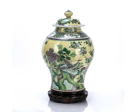 Biscuit porcelain vase and coverChinese, 19th Centurythe body decorated in famille jaune colours depicting a pheasant upon ro