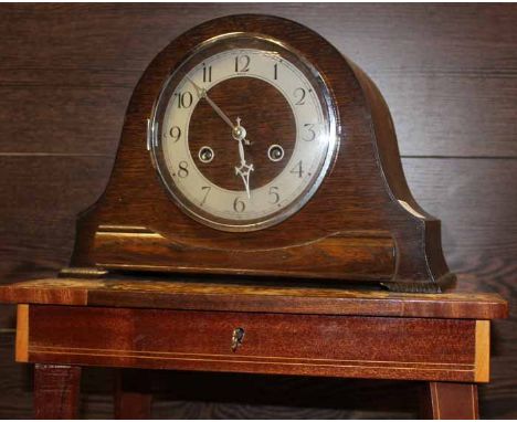 MARQUETRY MUSICAL OCCASIONAL TABLE
with scrolling design; together with a Anvil stained oak mantle clock, table 43cm high