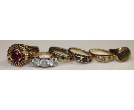 GROUP OF SIX GOLD RINGS
including a created ruby ring, an opal and diamond ring, and a Victorian sapphire and diamond ring, 2