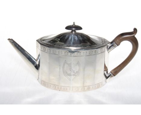 George III silver teapot by Foglebery &amp; Gilbert, London 1786, having panelled oval body with bright-cut decoration, 28cm 