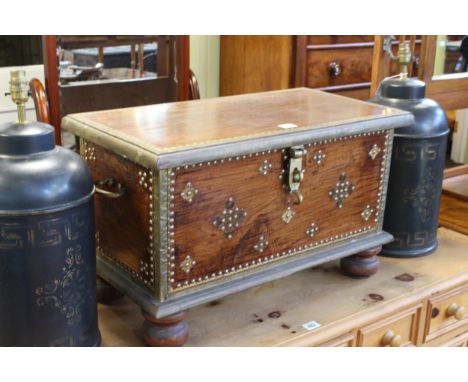 Small Eastern hardwood, brass and studded trunk on bun feet, 38cm by 65cm by 34cm.