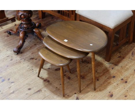 Nest of three vintage Ercol pebble tables (largest 40cm by 65cm by 45cm).