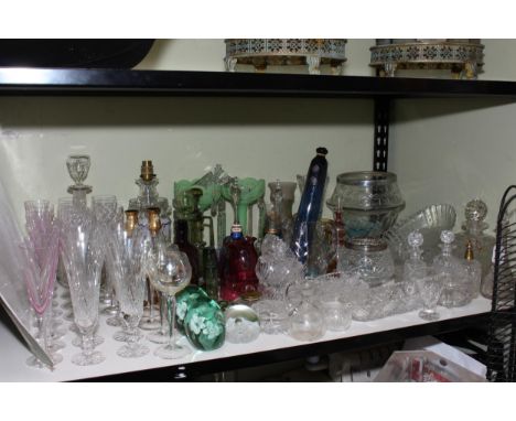 Collection of Victorian and later glass including two green glass dumps, rolling pin, lustres, decanters, glass bells, etc.