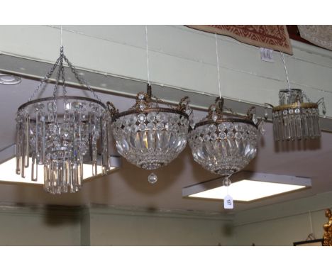 Collection of four lustre drop light fittings including a pair of circular fittings.