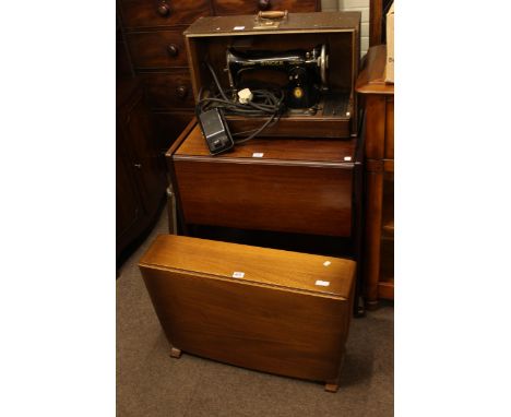 Ercol drop leaf coffee table, drop leaf trolley, SInger sewing machine and accessories.