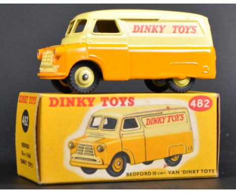 An original vintage Dinky Toys boxed diecast model 482 Bedford 10cwt Van. The model with yellow upper body and matching hub a