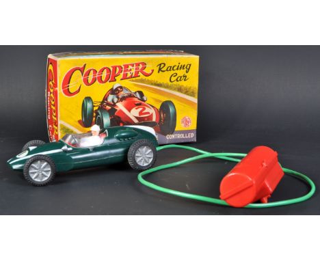 A vintage Empire Made battery operated remote control Cooper Racing Car.&nbsp;British Racing Green car with white plastic dri