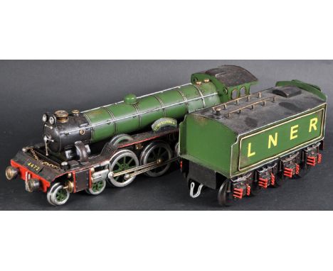 A large scale pressed tinplate locomotive engine model of a 4-6-2 Flying Scotsman with LNER tender. A non-running model only 