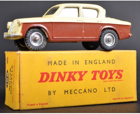 An original vintage Dinky Toys boxed diecast model No. 168 Singer Gazelle. Cream and brown body work with chrome hubs. Model 