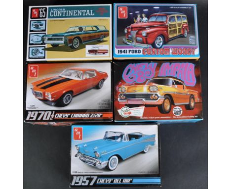 A collection of x5 assorted AMT 1/25 scale plastic model kits to include; 1081/12 Lincoln Continental, 638M/12 Chevy Bel Air,