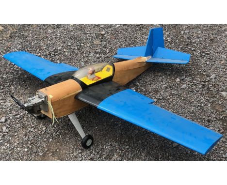 A large scale scratch built RC Radio Controlled model plane. Polystyrene and wood construction with pilot figure and front en