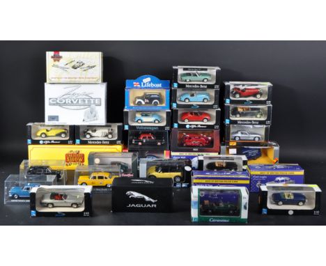 A large collection of assorted diecast model cars trucks and haulage vehicles of various scales and makers to include; New Ra