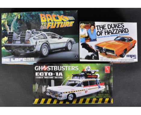 A collection of x3 TV &amp; Film related plastic model kits comprising; AMT 750M/12 1/25 scale Ghostbusters Ecto-1A, MPC 706L