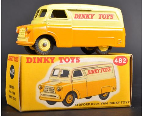 An original vintage Dinky Toys boxed diecast model 482 Bedford 10cwt Van. The model with yellow upper body and matching hub a