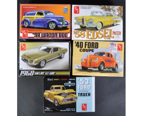 A collection of x5 assorted 1/25 scale AMT plastic model kits to include; 882/12 Ford Pickup Truck, 1141M/12 Ford Coupe, 1087