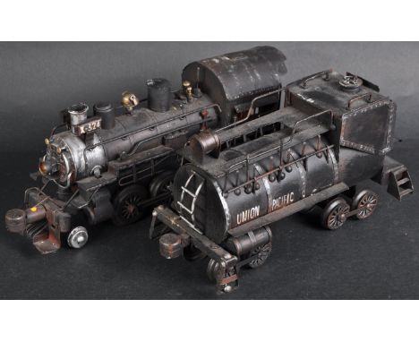 A large scale pressed tinplate locomotive engine model of a 2-6-0 Union Pacific with tender. A non running model only example