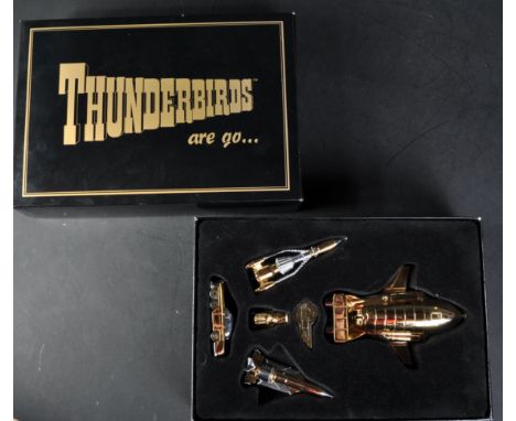 A vintage 1990s (1995) Matchbox Collectibles gold plated Thunderbirds plastic and diecast model No. TB54321. The set containi