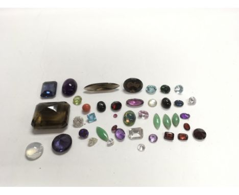A collection of gemstones to include moonstone, quartz and amethyst, approximately 230carats.