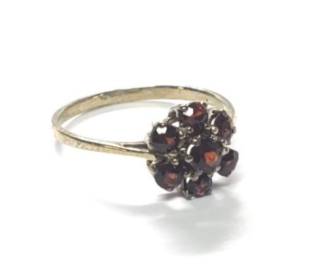 A gold ring set with garnets. Ring size R.