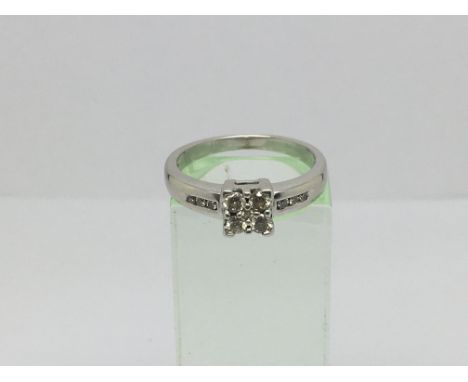 An 18ct white gold ring set with ten diamonds, approx.18ct, approx 4.1g and approx size M-N.
