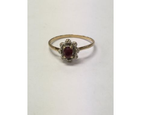 A diamond and ruby 9ct gold ring measuring approximately ring size s and weighing approximately 1.51g.