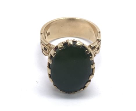 A 9ct gold ring set with a large green stone, approx 10g and approx size Q.