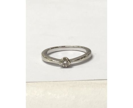 A diamond solitaire 9ct White gold ring, weighing approximately 2.2g and measuring approximately size k. NO RESERVE.