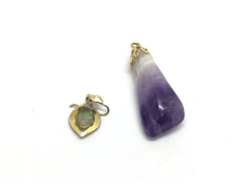 An amethyst pendant and one earring (a/f).