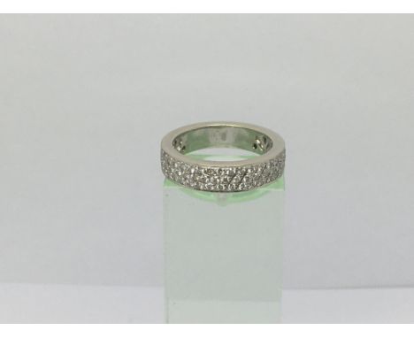 An 18ct white gold ring set with three rows of diamonds, approx 6.5g and approx size L.