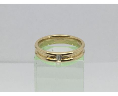 A 9ct gold wide band ring set with an eight point solitaire diamond, approx 4.3g and approx size N.