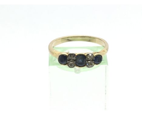 An 18ct gold diamond and sapphire ring approx size Q-R.