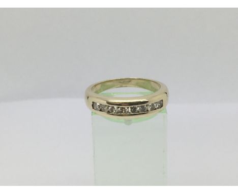 A 9ct gold half eternity ring set with 8 diamonds, approx .33ct, approx 4.7g and approx size P-Q.