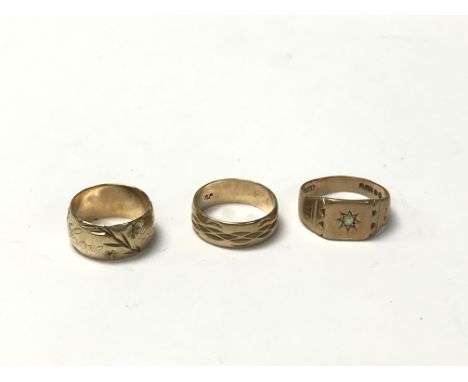 Three 9 carat gold rings weighing approximately 12.8g. From left to right approximate ring sizes are L, between p and q, and 