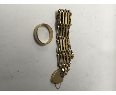 A 9 ct gold gate bracelet and a 9 ct gold wedding band 16 grams.