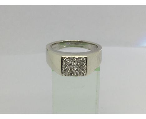 A gents 9ct white gold signet ring set with 16 diamonds, approx .33ct, approx 8.3g and approx size S-T.