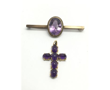 A gold and amethyst brooch together with an unmarked gold cross pendant (2), approx 8.6g.