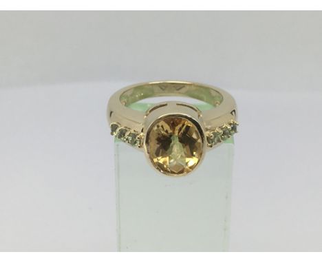 A 9ct gold dess ring set with topaz and citrine, approx 5.8g and approx size N-O.