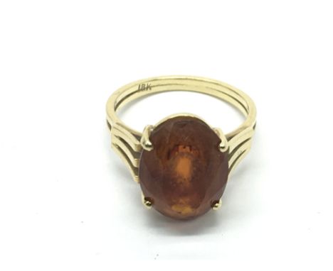 An 18ct gold ring set with citrine, approx 4.5g and approx size M.