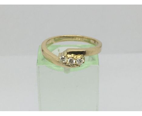 An 18ct gold three stone diamond ring, approx.10ct, approx 4.3g and approx size M.