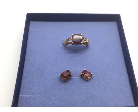 A 9ct gold ruby ring and a pair of matching earrings, heat treated stones, approx 5g.