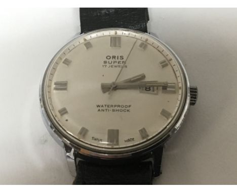 A Vintage Gents Oris Super 17 Jewel Manual wind watch with a good early modern design silvered dial with raised batons and da