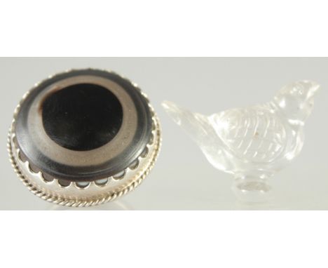 AN ISLAMIC GLASS BIRD, together with a large ring (2).